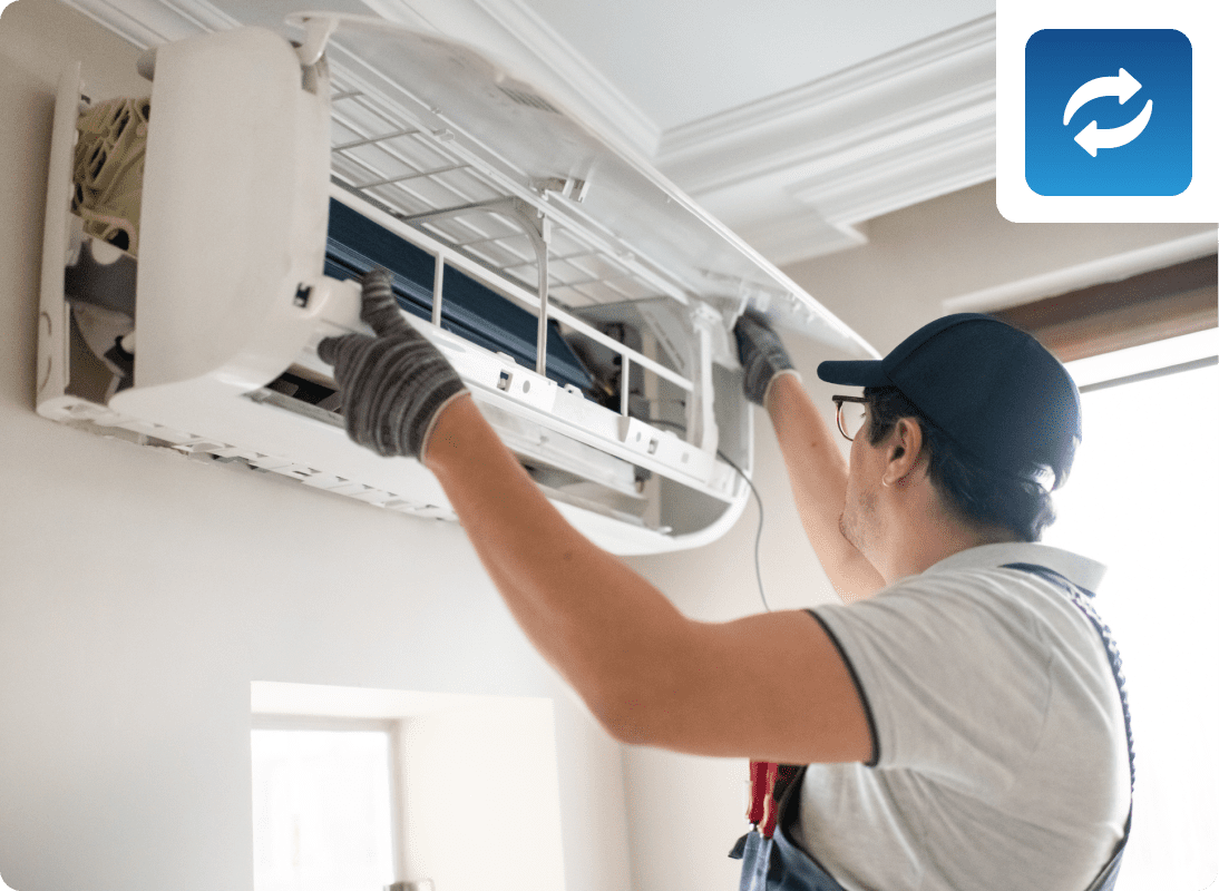 Technician repairing air conditioner unit