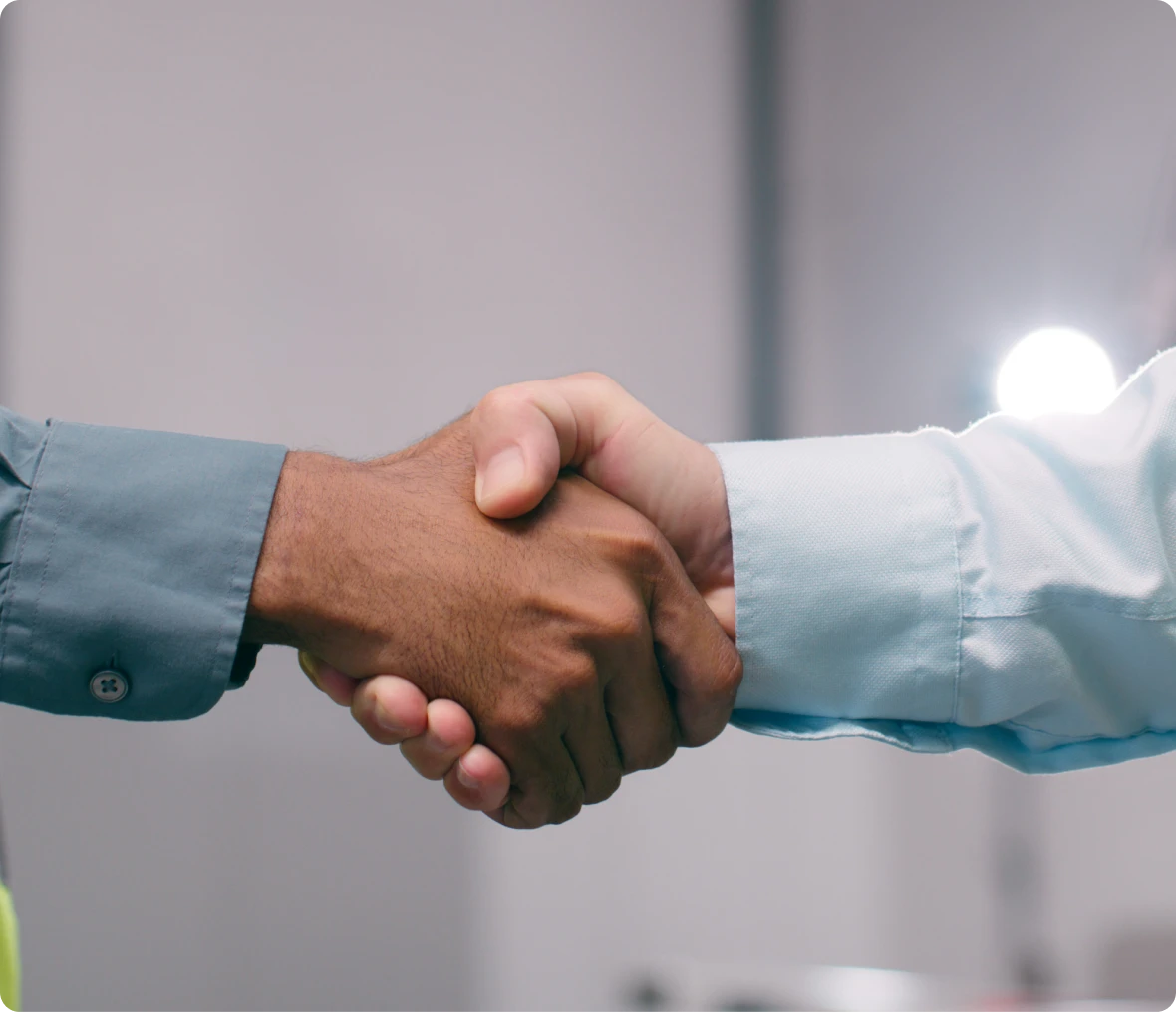 Two people shaking hands in agreement